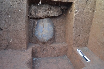 Figure 5. Unit 3 burial jar positioned under a quartz-veined sandstone slab.